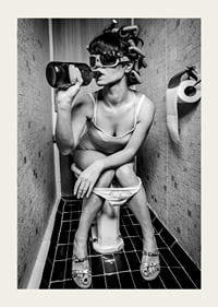Black and white photo of woman with sunglasses in toilet-3