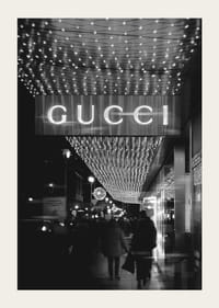 Black and white city scene with Gucci sign and string lights-3