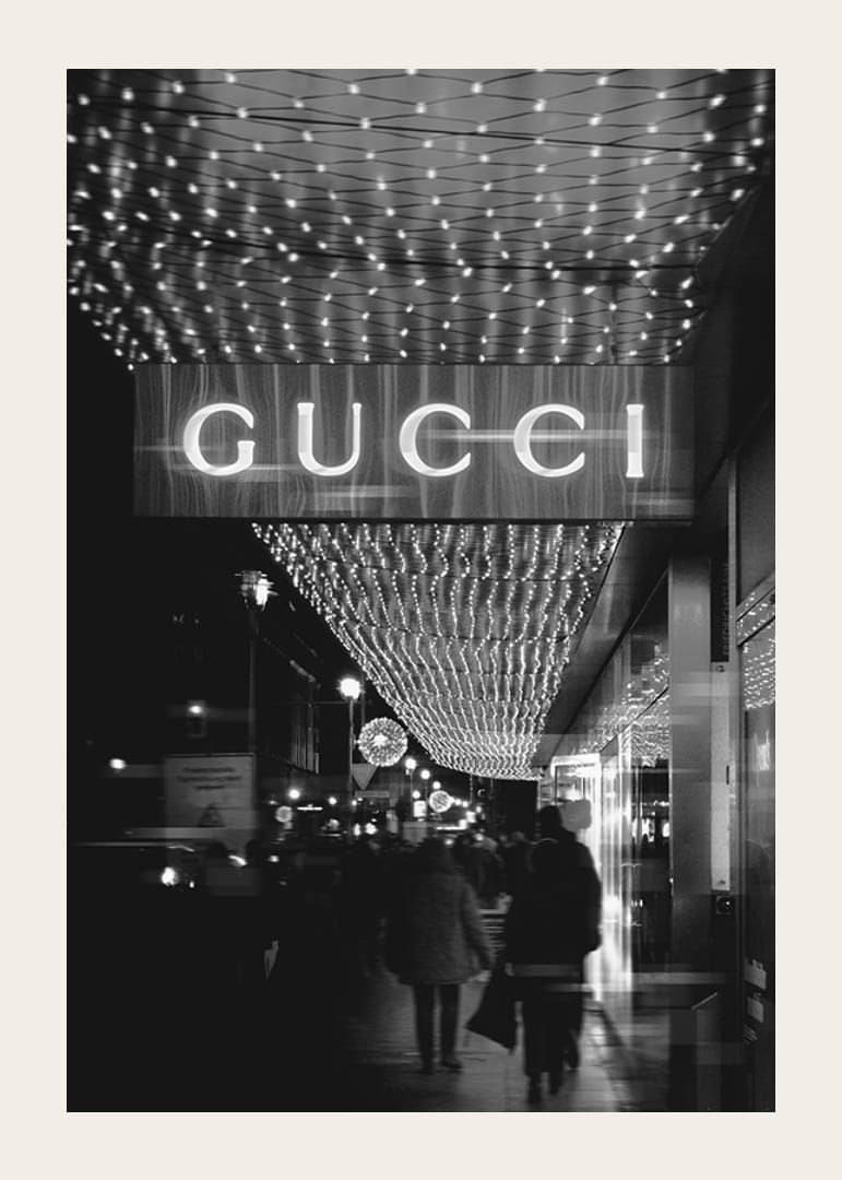 Black and white city scene with Gucci sign and string lights-12