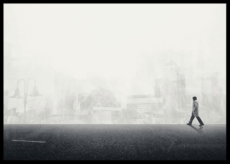 Illustrated man walking on empty street with city silhouette in grayscale-12