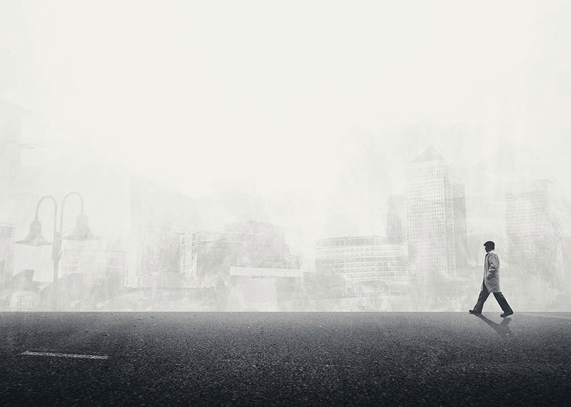 Illustrated man walking on empty street with city silhouette in grayscale-12