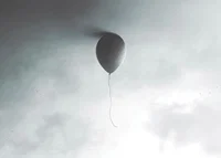 Surreal balloon against light gray sky with clouds-7
