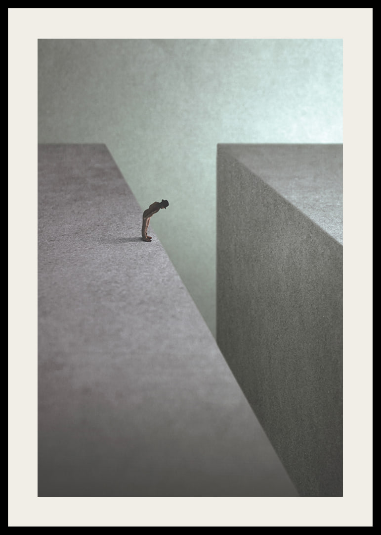 Illustrated man at the edge of wide gorge in gray tones-12
