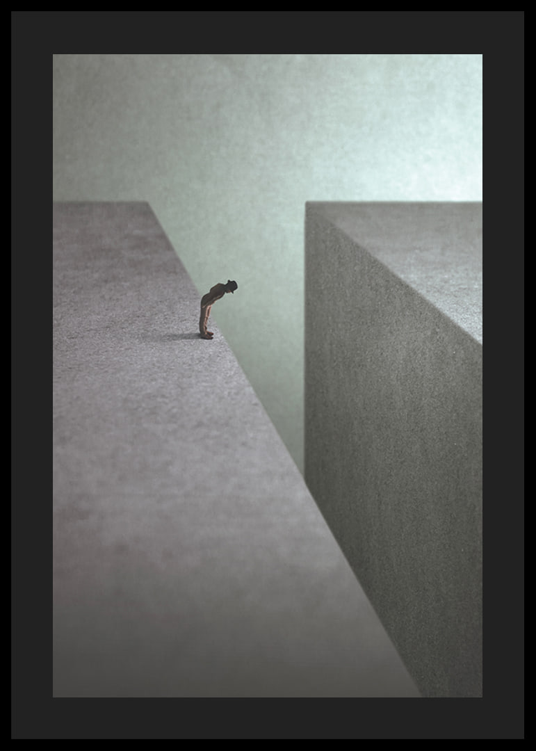 Illustrated man at the edge of wide gorge in gray tones-12