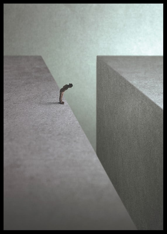 Illustrated man at the edge of wide gorge in gray tones-12