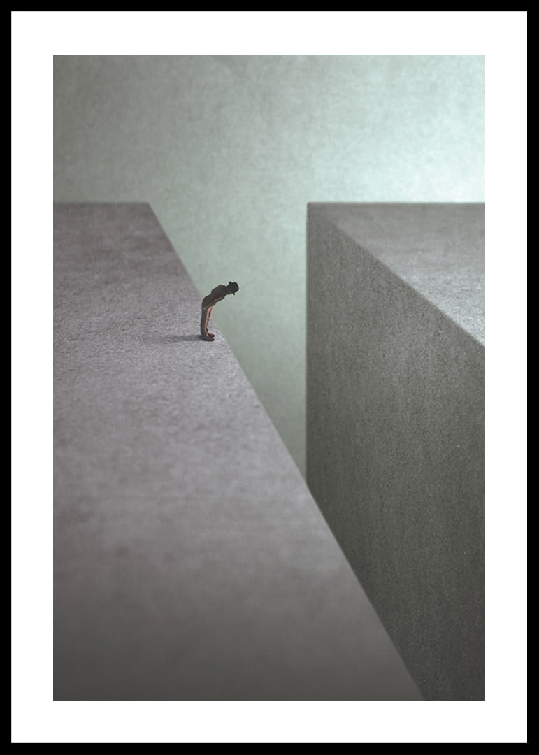Illustrated man at the edge of wide gorge in gray tones-12