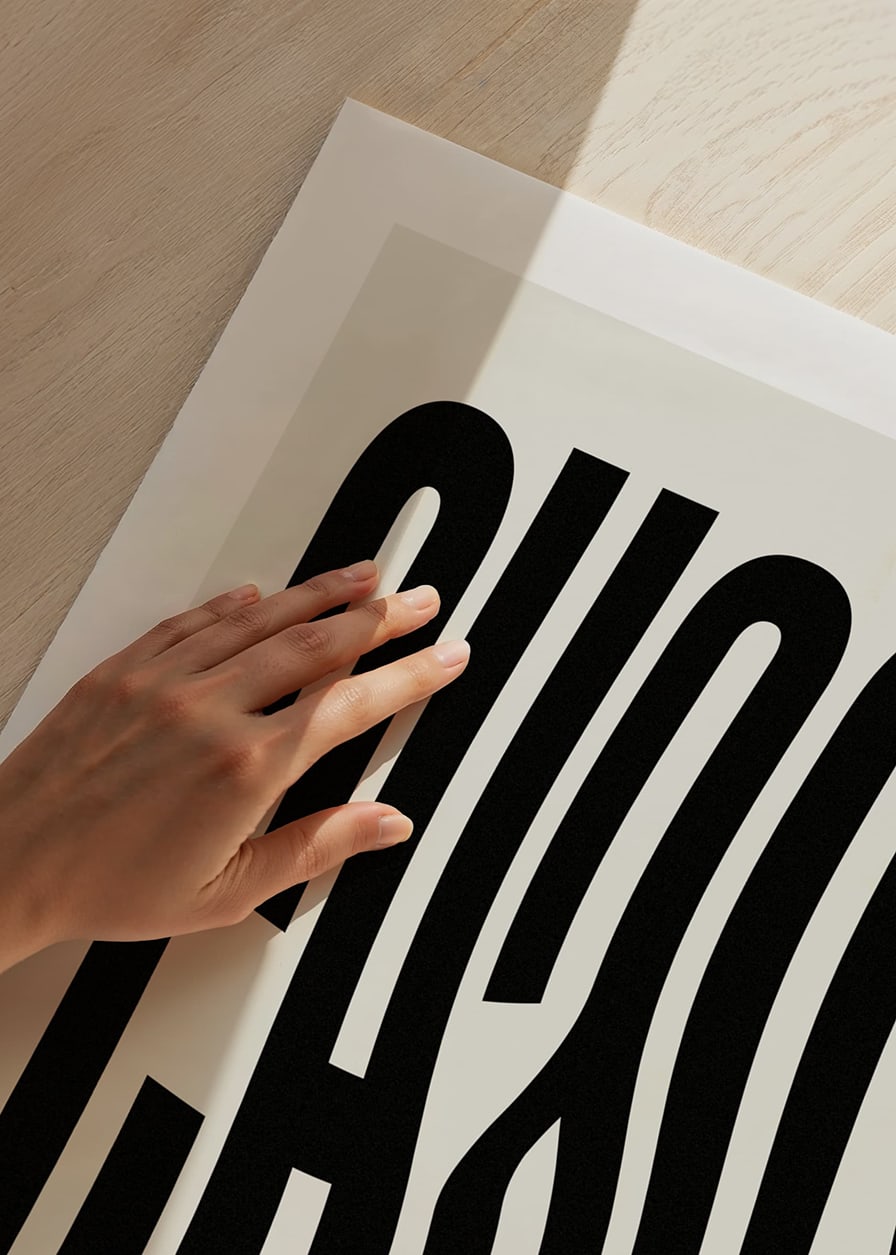 Graphic text illustration with the word CHAOS in black against beige-12