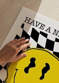 Illustrated yellow smiley against black and white checkered background-3