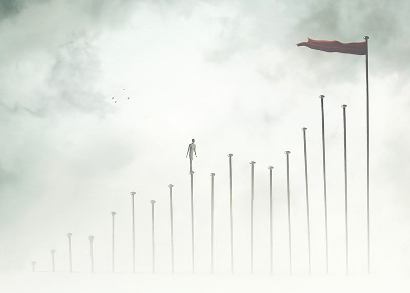 Surreal illustration of man on tall pillars in fog-12