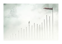 Surreal illustration of man on tall pillars in fog-1