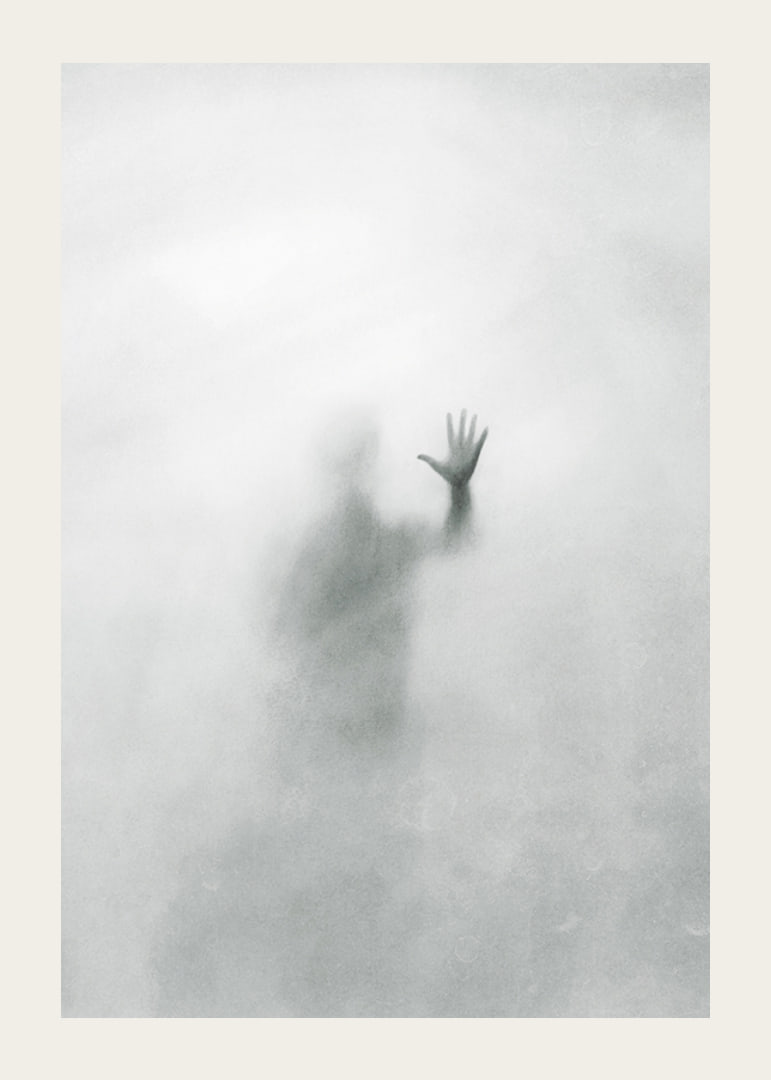 Silhouette of person behind hazy glass in grayscale-12