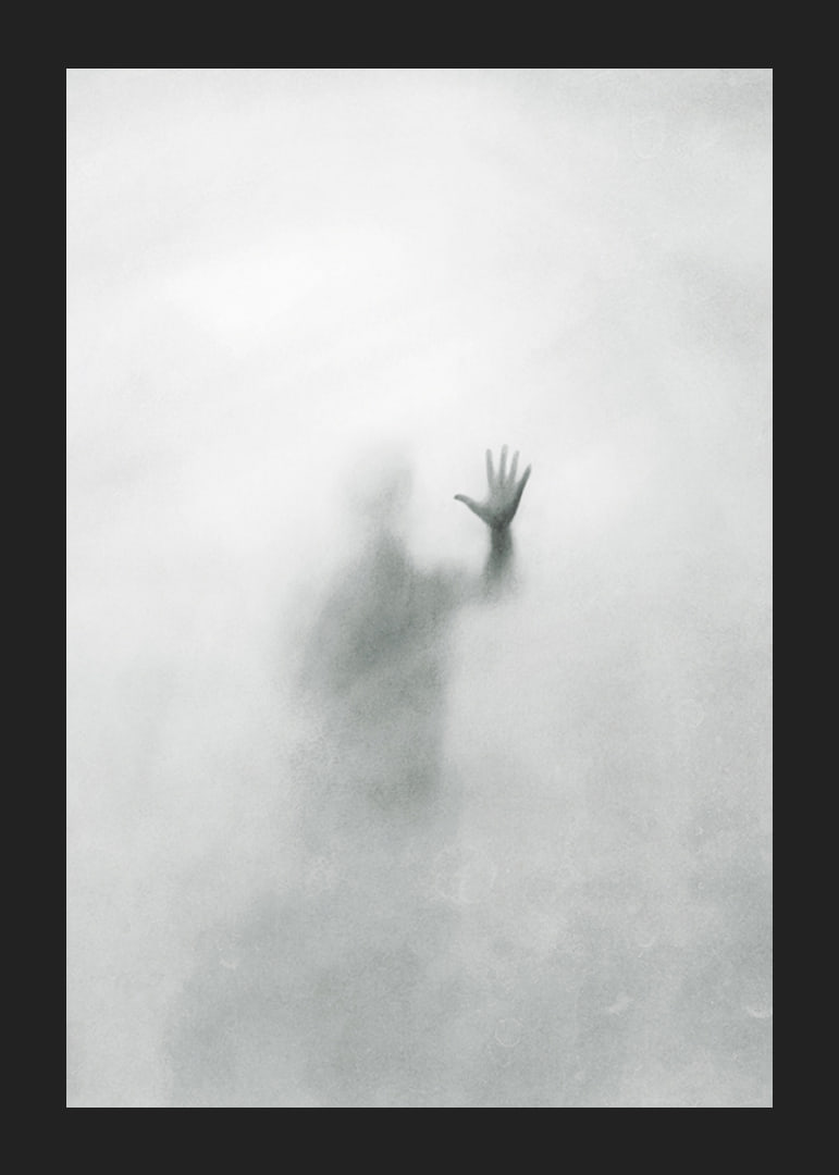 Silhouette of person behind hazy glass in grayscale-12