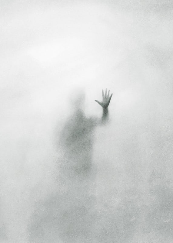 Silhouette of person behind hazy glass in grayscale-12