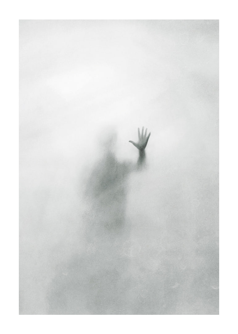 Silhouette of person behind hazy glass in grayscale-12