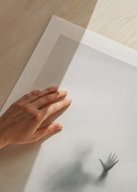 Silhouette of person behind hazy glass in grayscale-9