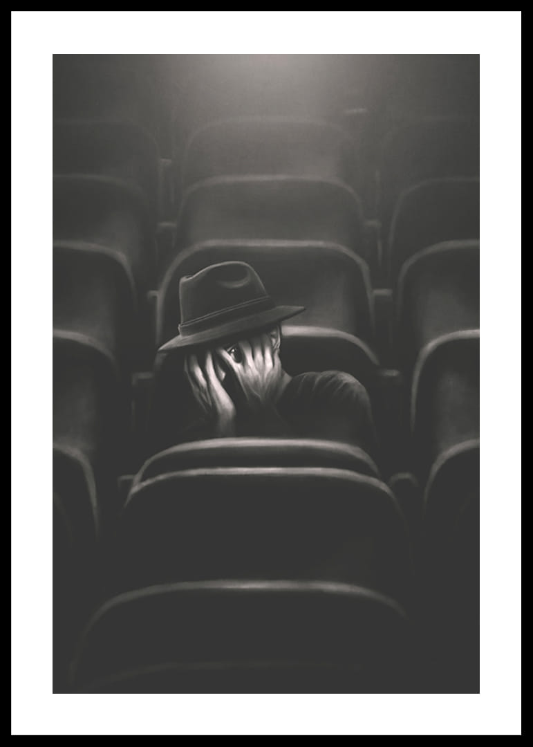 Illustrerad man med hatt gömmer ansiktet i mörk biosalong-12