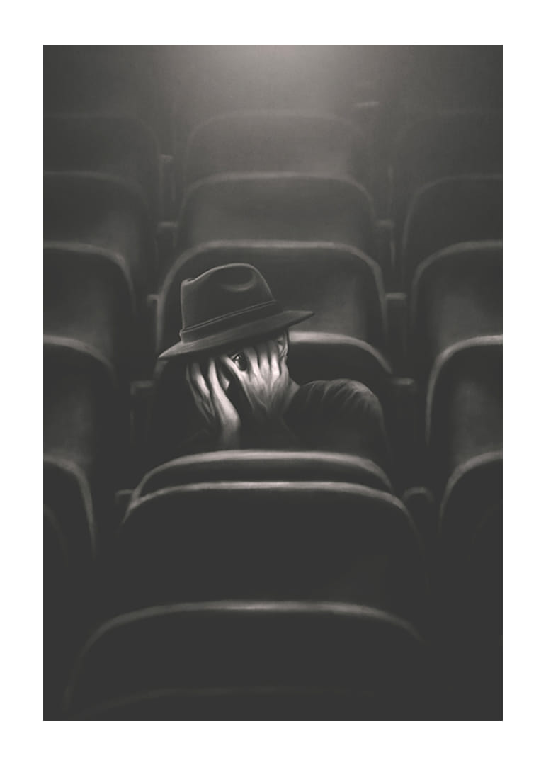 Illustrerad man med hatt gömmer ansiktet i mörk biosalong-12