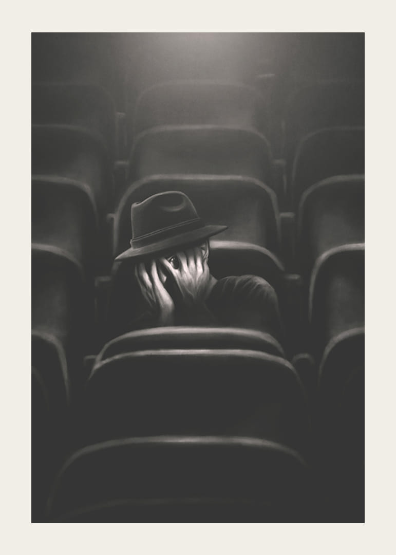 Illustrerad man med hatt gömmer ansiktet i mörk biosalong-12