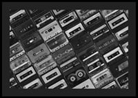 Black and white photograph of several cassette tapes in a checkerboard pattern-0