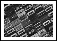 Black and white photograph of several cassette tapes in a checkerboard pattern-2