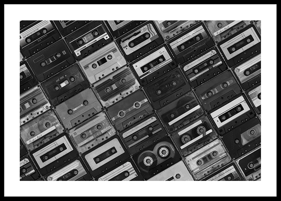 Black and white photograph of several cassette tapes in a checkerboard pattern-12