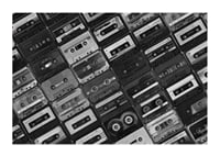 Black and white photograph of several cassette tapes in a checkerboard pattern-3