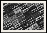 Black and white photograph of several cassette tapes in a checkerboard pattern-4