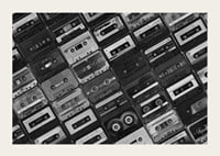 Black and white photograph of several cassette tapes in a checkerboard pattern-5
