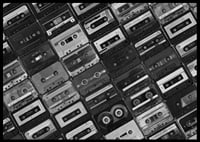 Black and white photograph of several cassette tapes in a checkerboard pattern-6