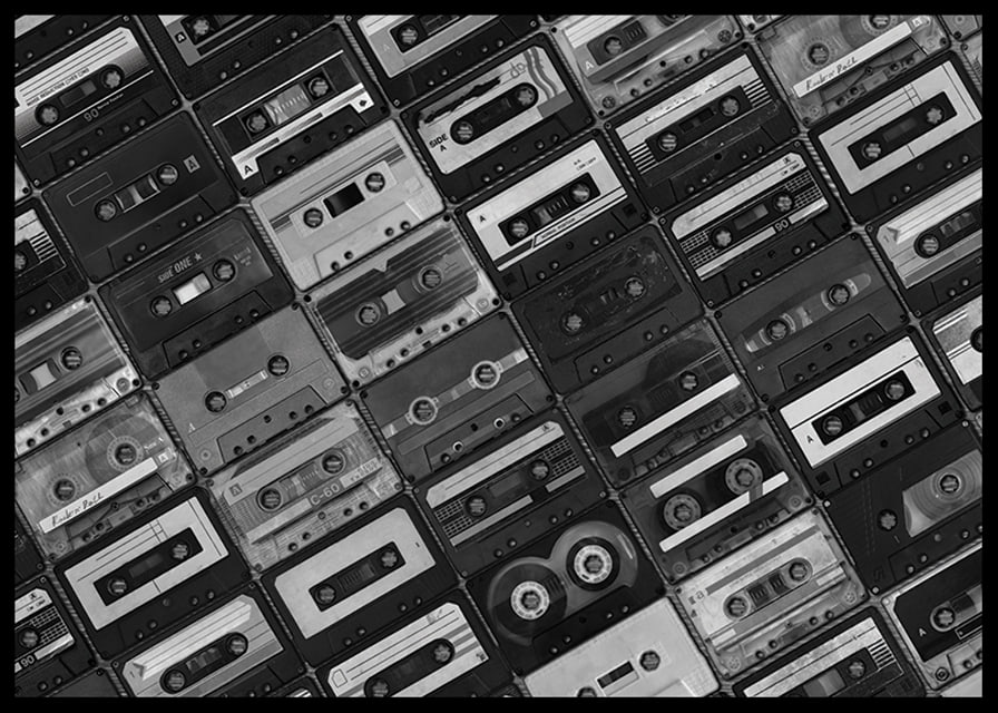Black and white photograph of several cassette tapes in a checkerboard pattern-12