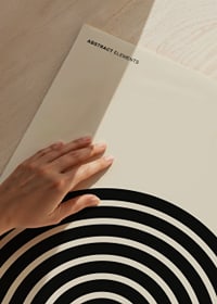 Graphic motif with black circular lines on beige background-3