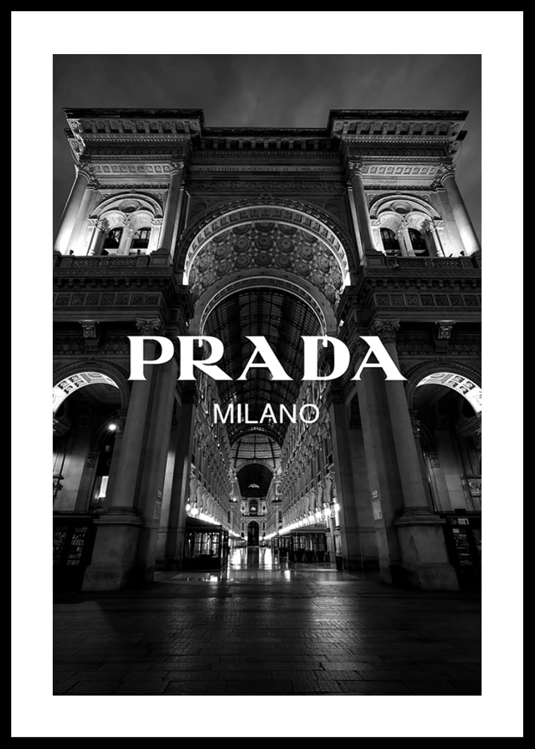 Black and white night image of illuminated arcade in Milan with Prada text-12