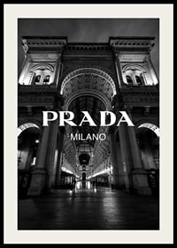 Black and white night image of illuminated arcade in Milan with Prada text-4