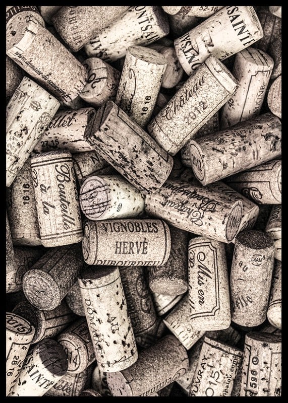 Photograph of several wine corks with prints in beige shades-12