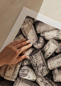 Photograph of several wine corks with prints in beige shades-9
