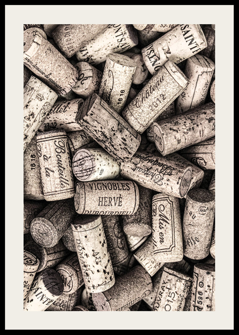 Photograph of several wine corks with prints in beige shades-12