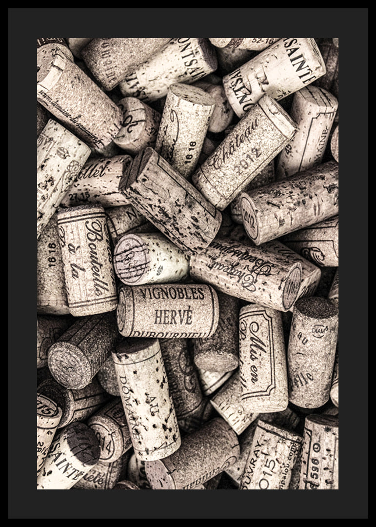 Photograph of several wine corks with prints in beige shades-12