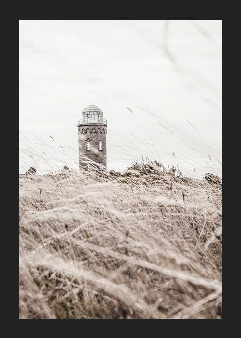Photographic motif of lighthouse behind waving dry grass field-12