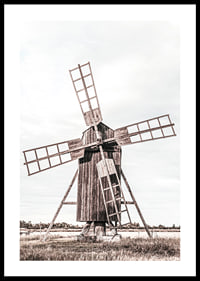 Photograph of old wooden windmill in open field-0