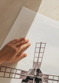 Photograph of old wooden windmill in open field-9