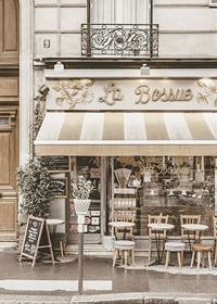 Photograph of Parisian cafe with outdoor seating in beige tones-7