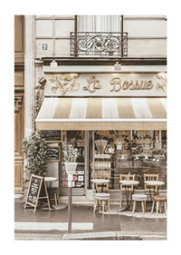 Photograph of Parisian cafe with outdoor seating in beige tones-1