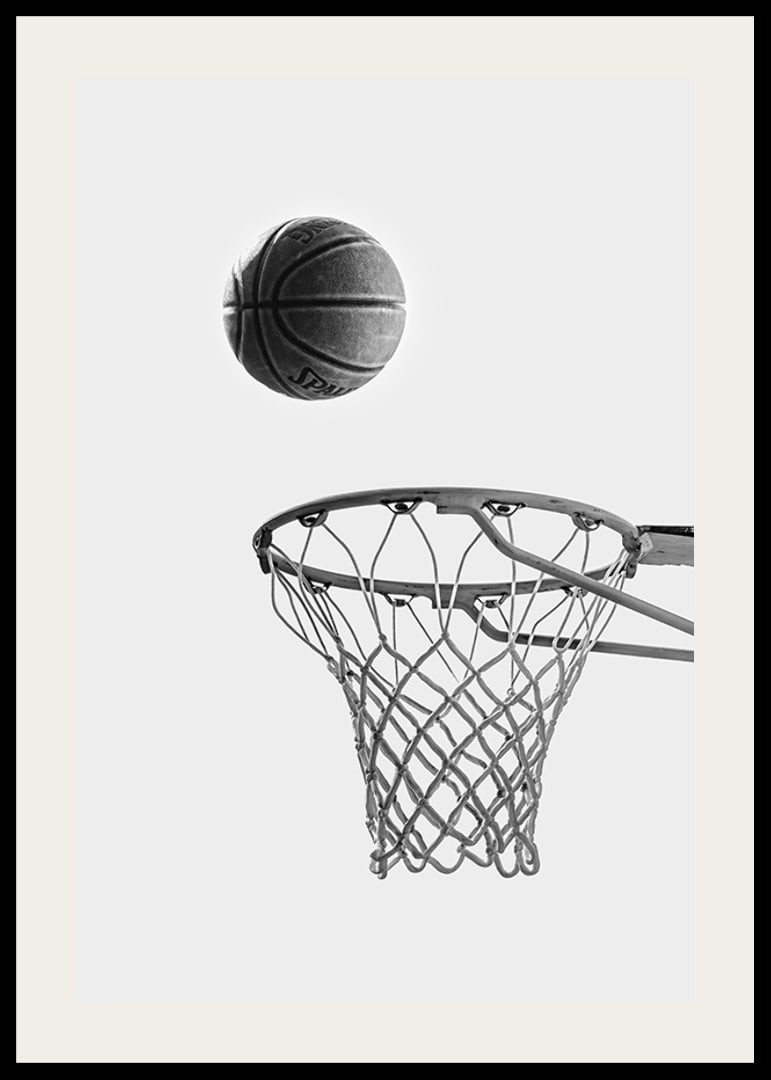 Black and white photo of basketball above basket against light background-12