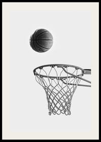 Black and white photo of basketball above basket against light background-2