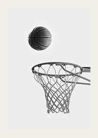 Black and white photo of basketball above basket against light background-3