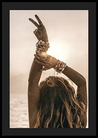 Woman with arms in the air, shell bracelet and backlight by the sea-4