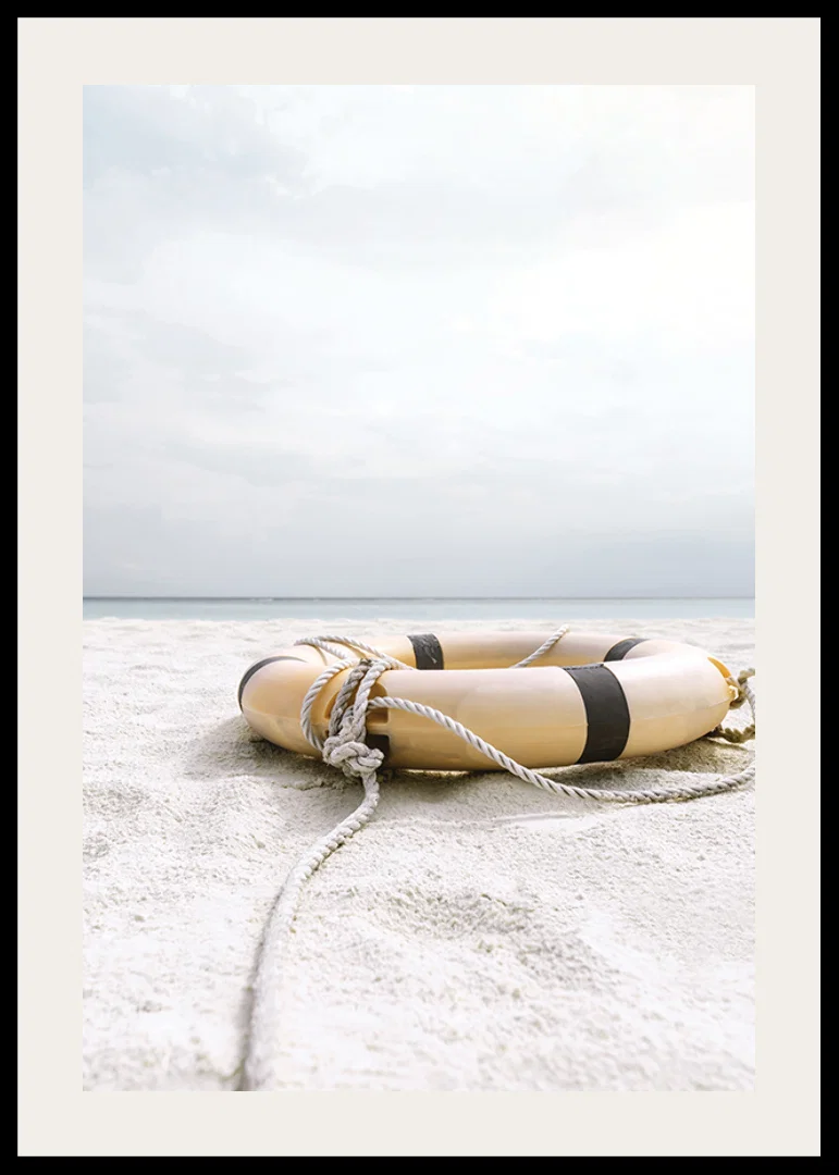 Photograph of lifebuoy on light sandy beach with ocean in the background-12