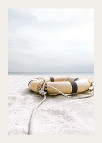 Photograph of lifebuoy on light sandy beach with ocean in the background-3