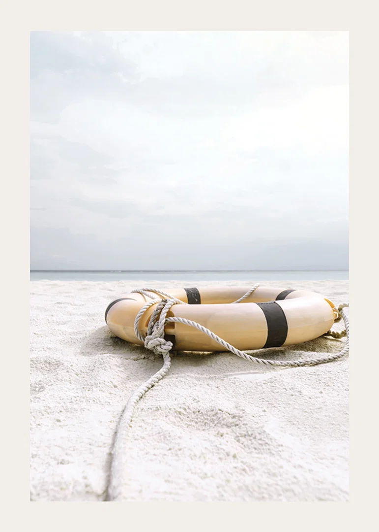 Photograph of lifebuoy on light sandy beach with ocean in the background-12