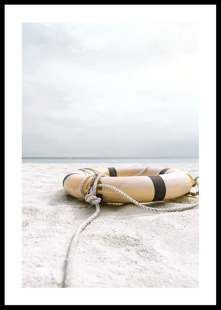 Photograph of lifebuoy on light sandy beach with ocean in the background-12